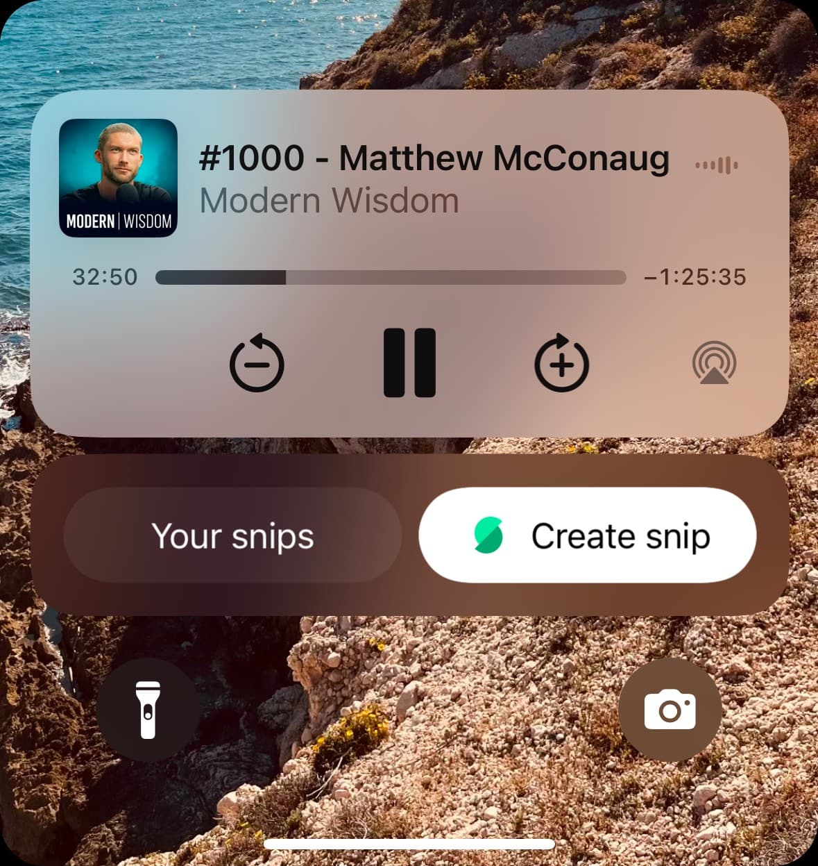Screenshot of the iPhone lockscreen displaying Snipd's snipping widget with create snip and view snips buttons.
